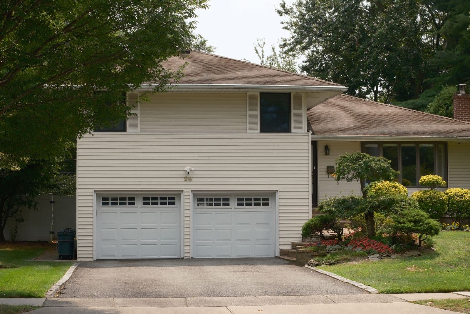 Two-story house with a double garage and a landscaped yard