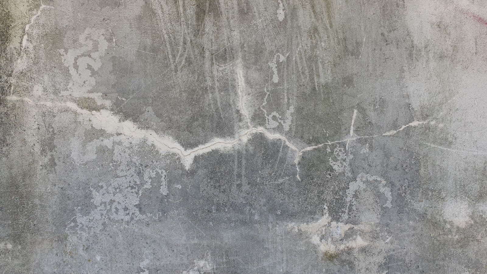 Cracked, weathered concrete wall